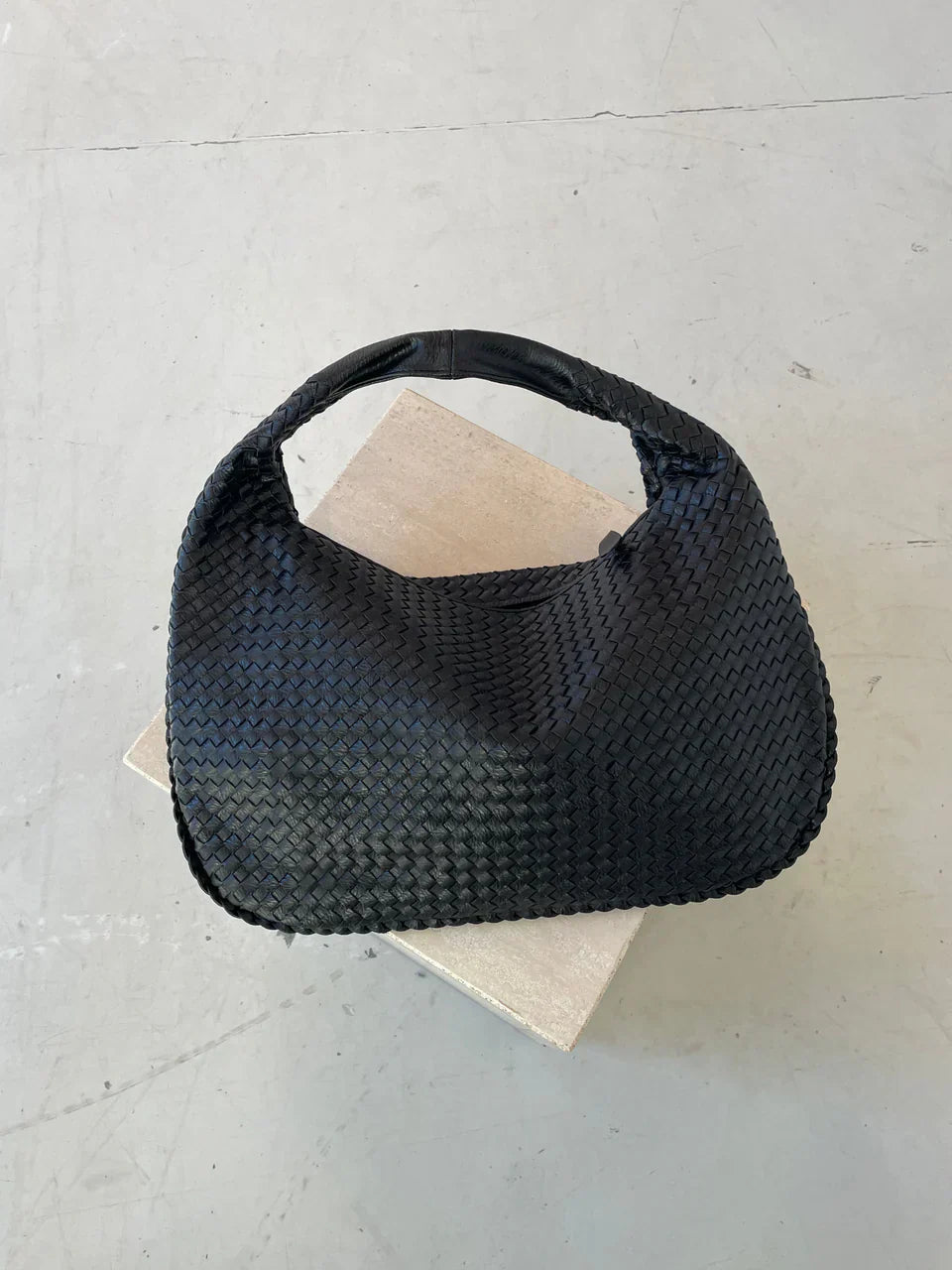 Jade – Bolso de mano trenzado lujoso