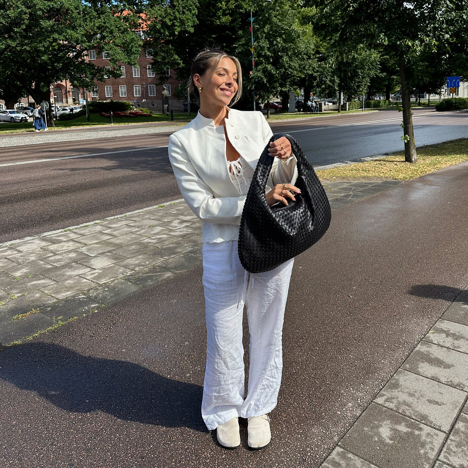 Jade – Bolso de mano trenzado lujoso