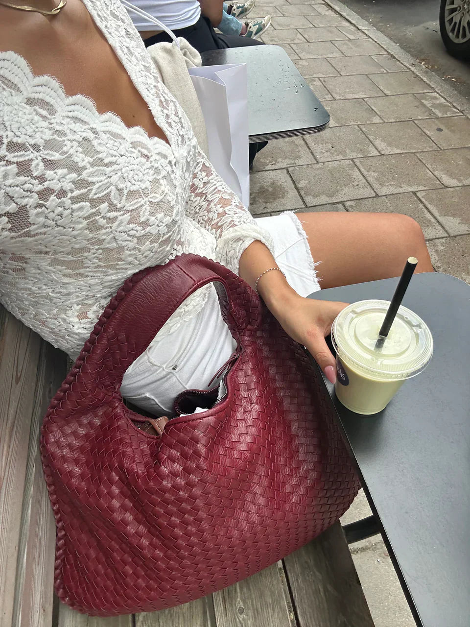 Jade – Bolso de mano trenzado lujoso
